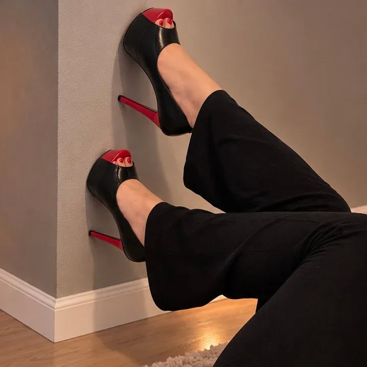 Fanny Secrets showing off black high heels with red soles