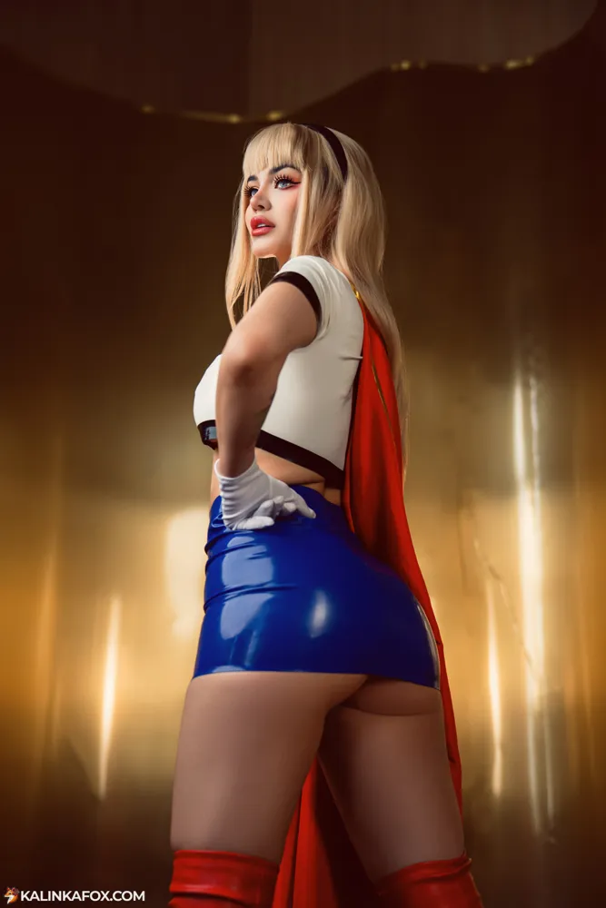 Kalinka Fox in a Supergirl cosplay with red cape